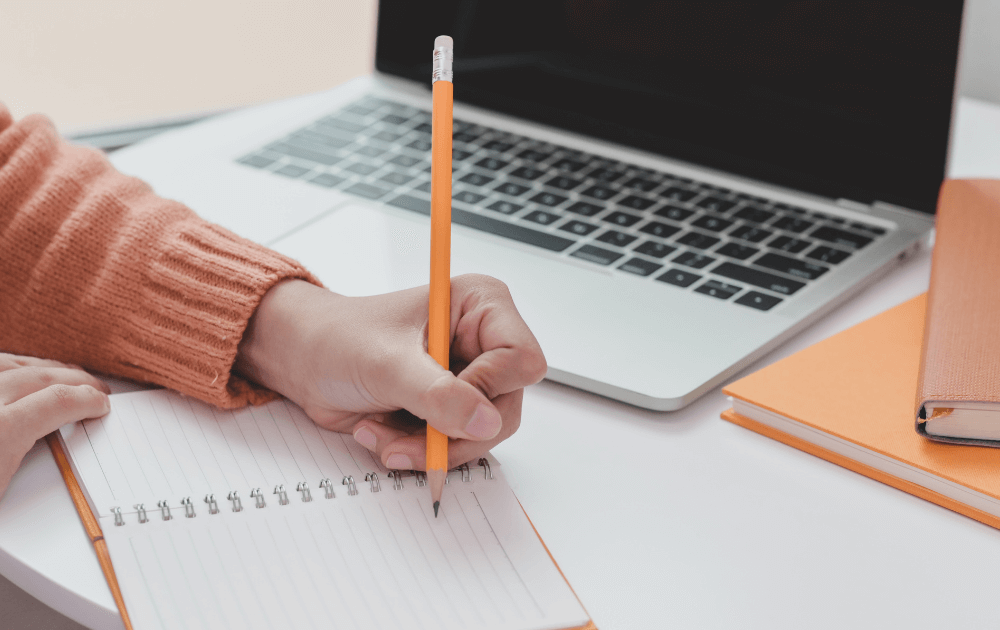 Writing on a notebook
